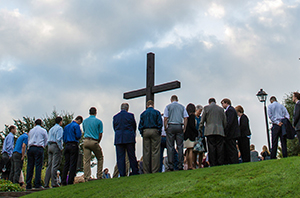 people standing outside praying in Dallas, Texas