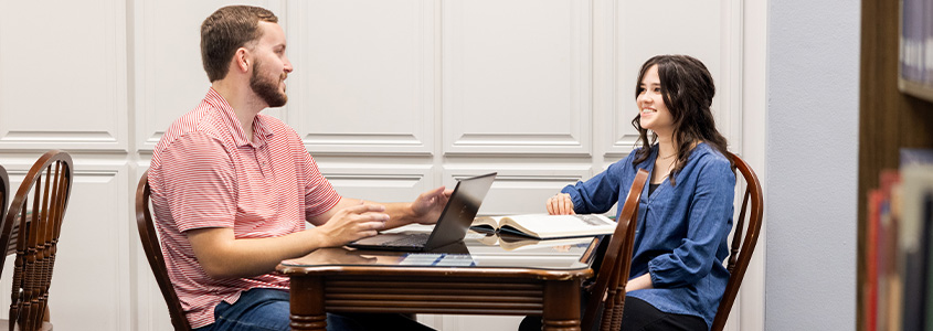 university students studying in library