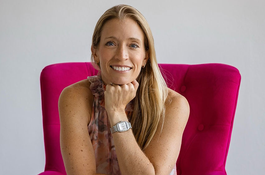 headshot of Helen Bowles sitting on a pink chair