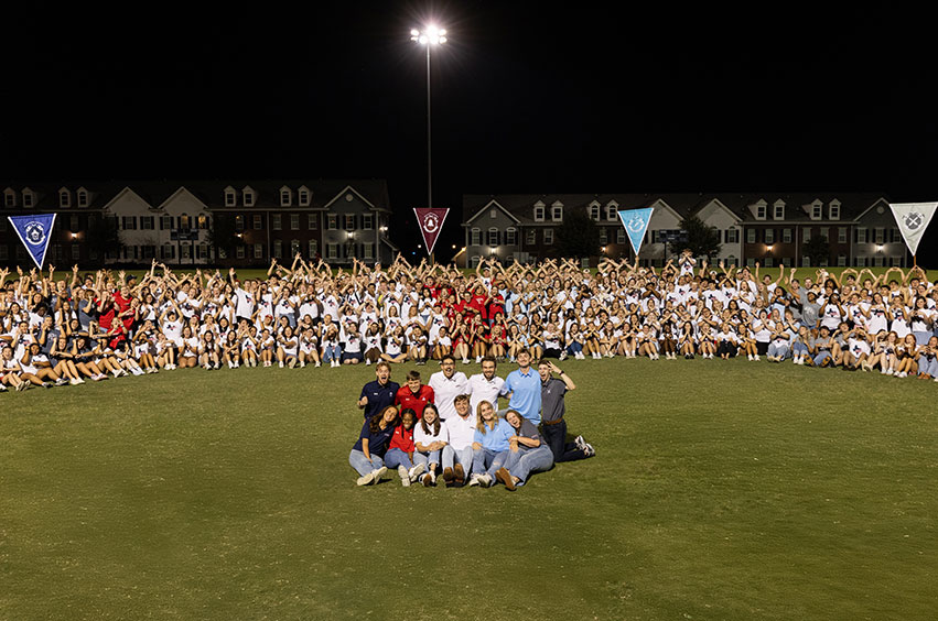 2025 SWAT group outside at night on the new intramural field