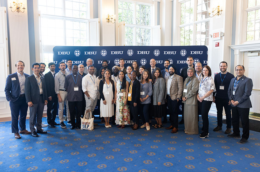 group of people at the International Delegation in the Great Hall at DBU